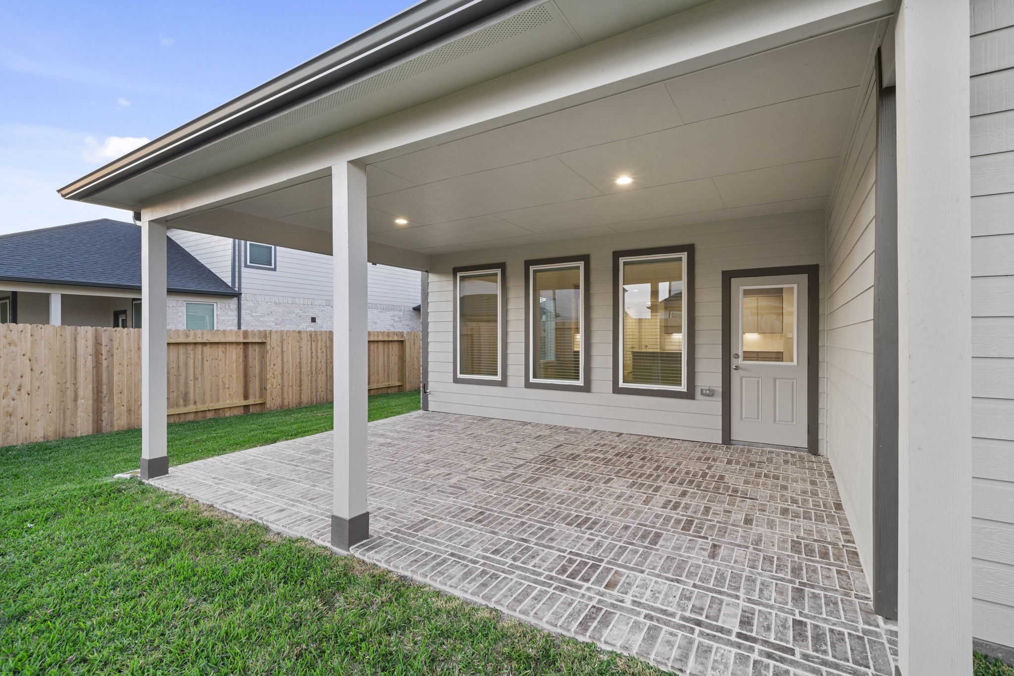 3015 Boulder Ridge Drive Rosenberg, TX 77471 - Photo 32 of 34 a view of a house with a yard and porch