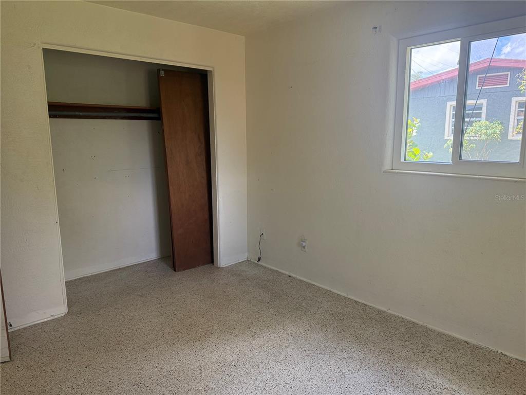 113 Neptune Drive Edgewater, FL 32132 - Photo 11 of 24 an empty room with windows and closet