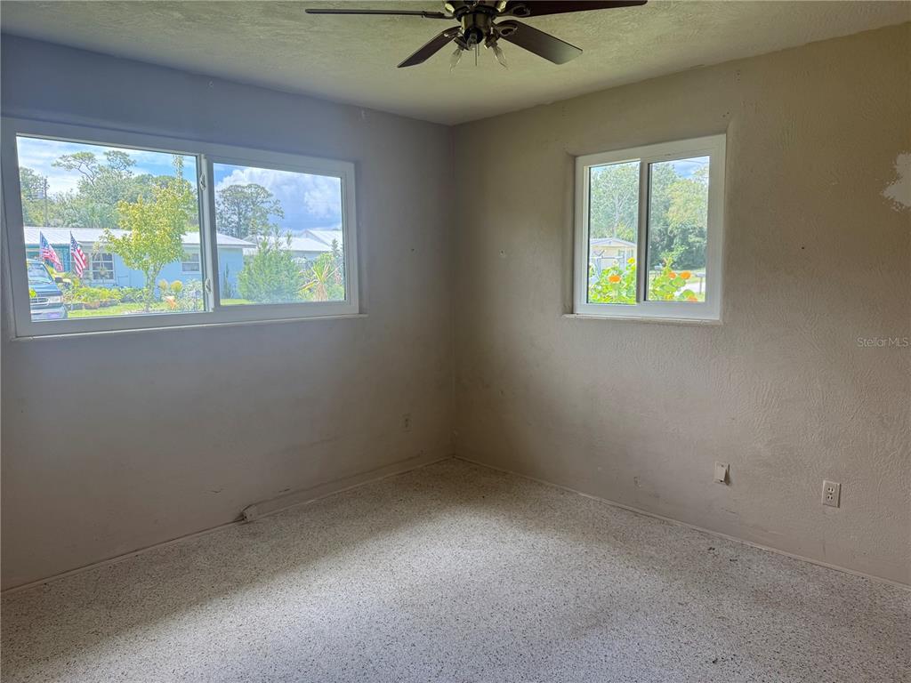 113 Neptune Drive Edgewater, FL 32132 - Photo 12 of 24 an empty room with a window