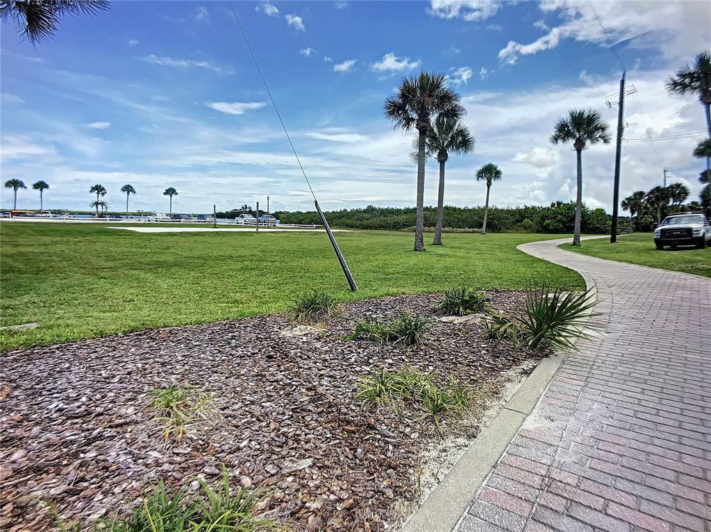 113 Neptune Drive Edgewater, FL 32132 - Photo 22 of 24 a view of a park with swings