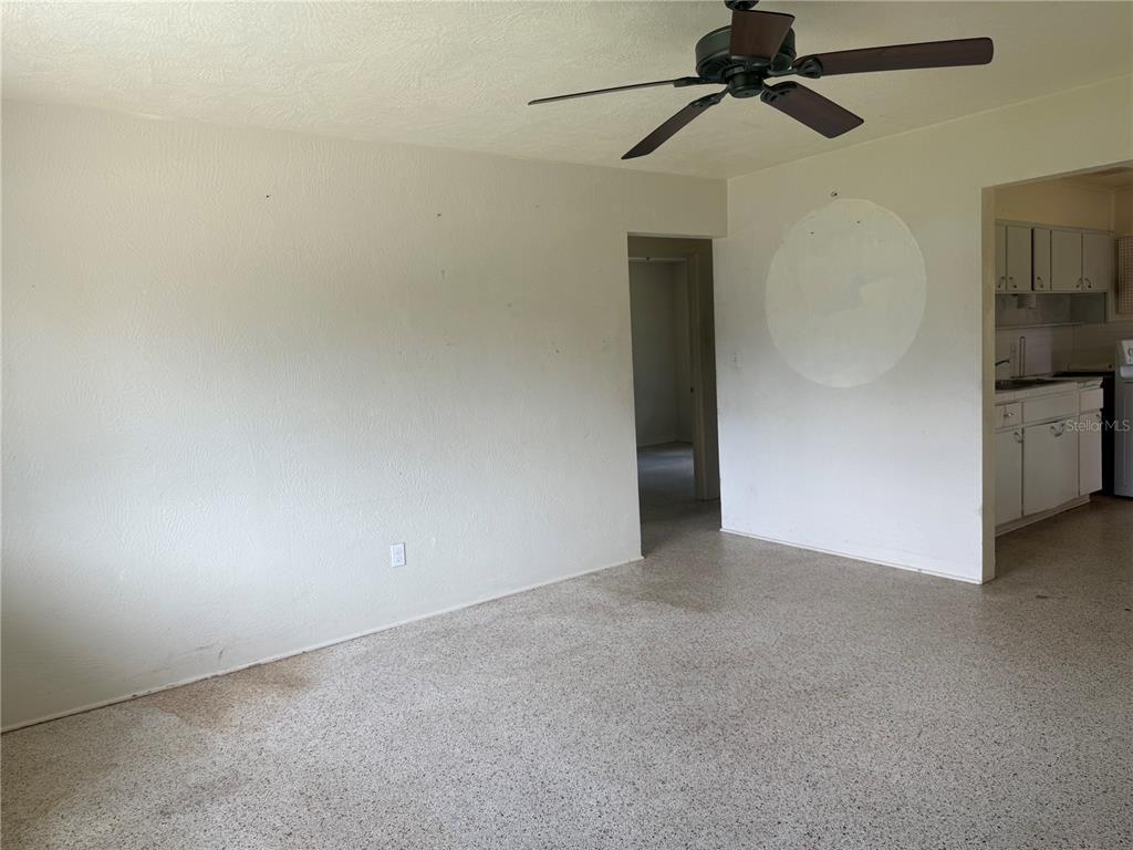 113 Neptune Drive Edgewater, FL 32132 - Photo 8 of 24 a view of empty room with windows