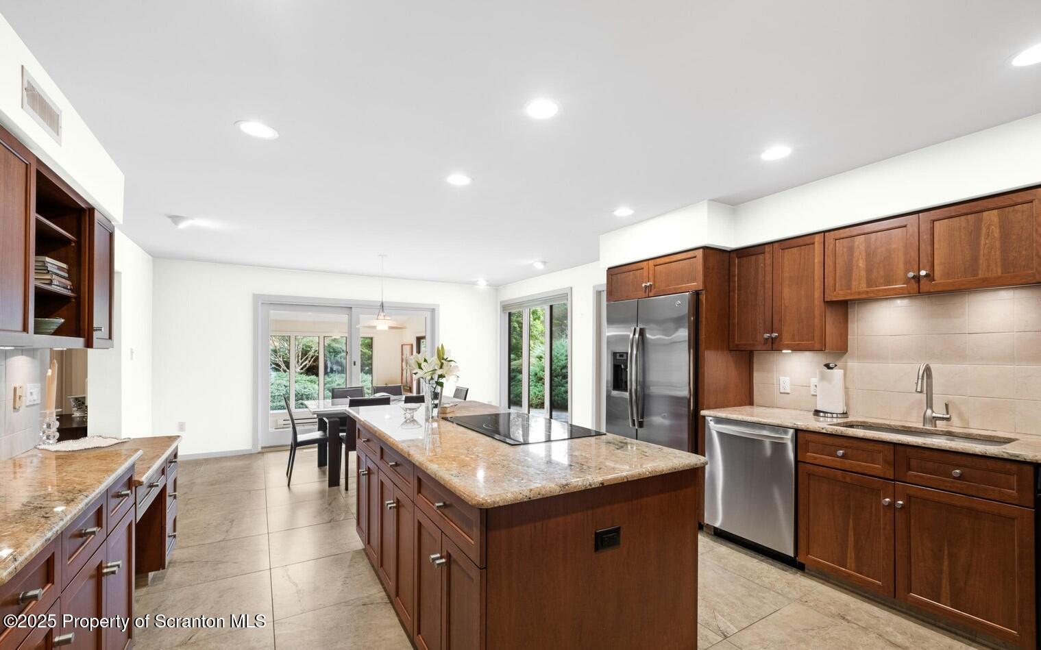 325 T-718 Shavertown, PA 18708 - Photo 12 of 41 a kitchen with granite countertop a sink a counter top space stainless steel appliances and cabinets