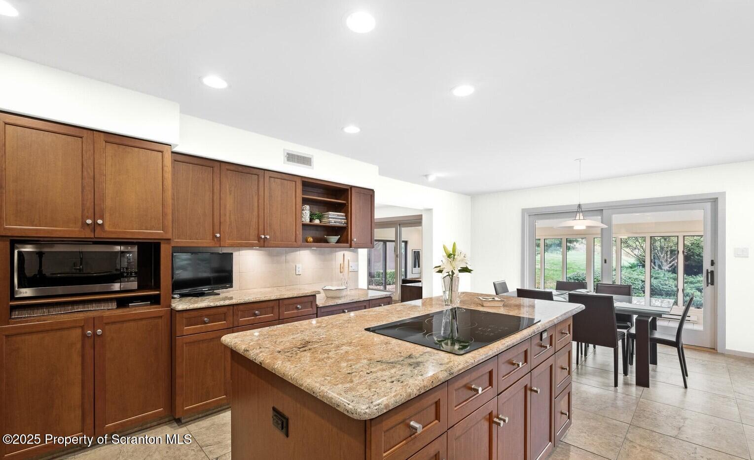 325 T-718 Shavertown, PA 18708 - Photo 13 of 41 a kitchen with a stove a sink and a microwave