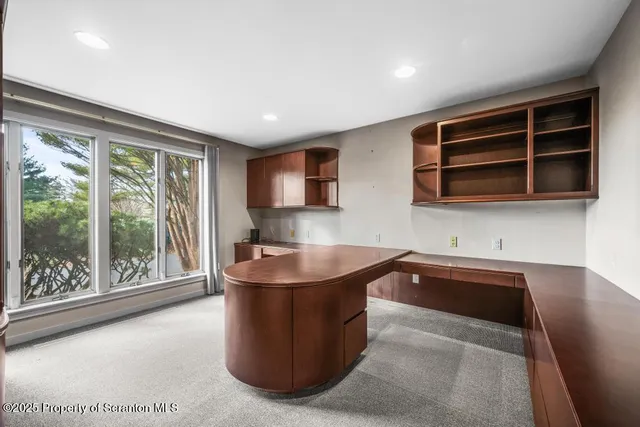 a kitchen with a sink and large window