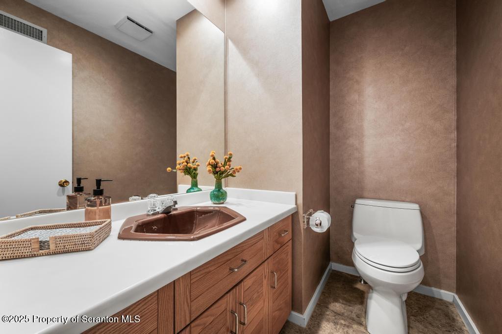 325 T-718 Shavertown, PA 18708 - Photo 19 of 41 a bathroom with a toilet sink and mirror