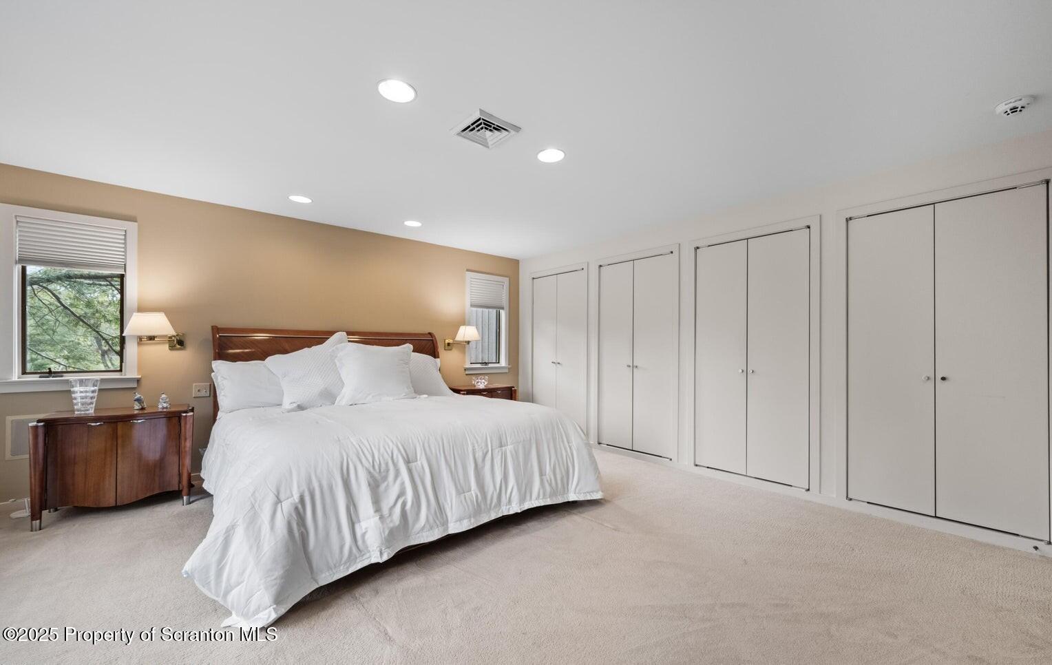 325 T-718 Shavertown, PA 18708 - Photo 22 of 41 a bedroom with a large bed and a night stand