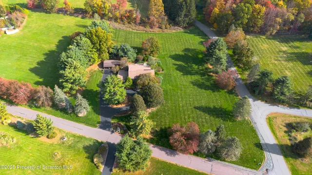 an aerial view of a houses with outdoor space