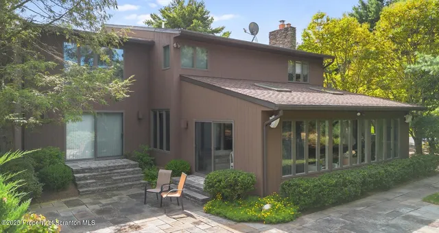 a front view of a house with a porch