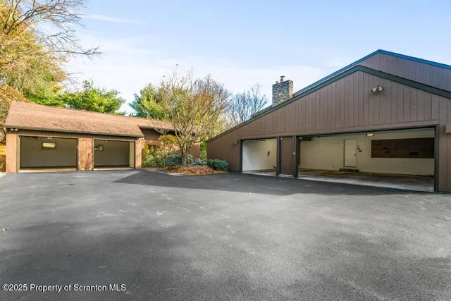a view of a house with a yard and garage