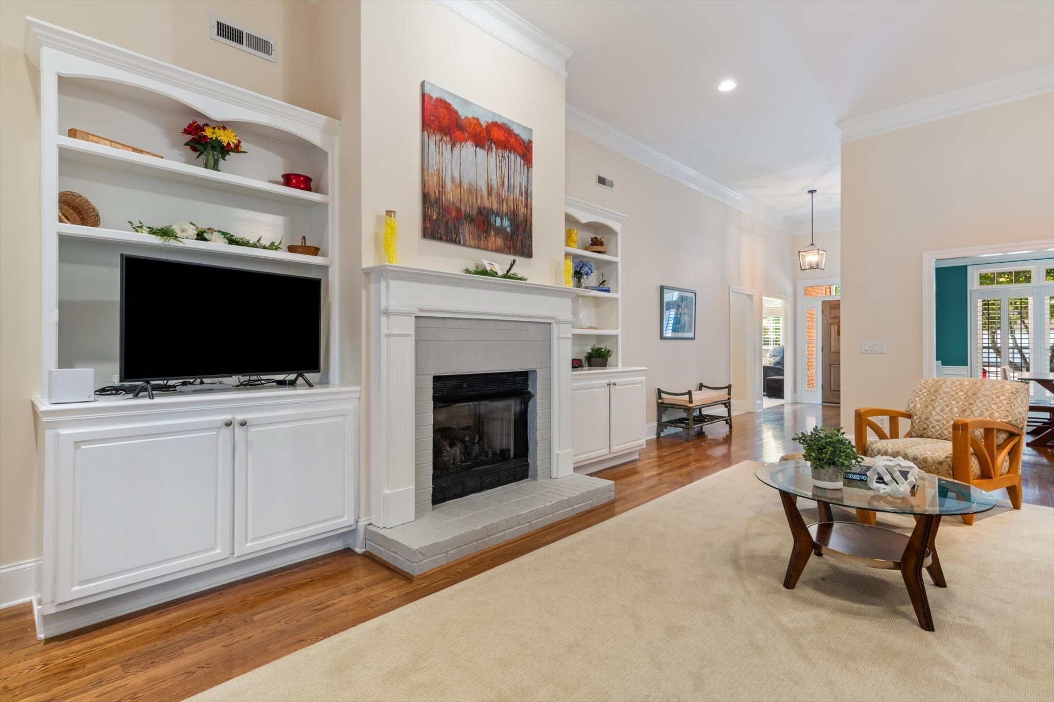 272 Noah Drive Franklin, TN 37064 - Photo 9 of 35 a living room with furniture a flat screen tv and a fireplace