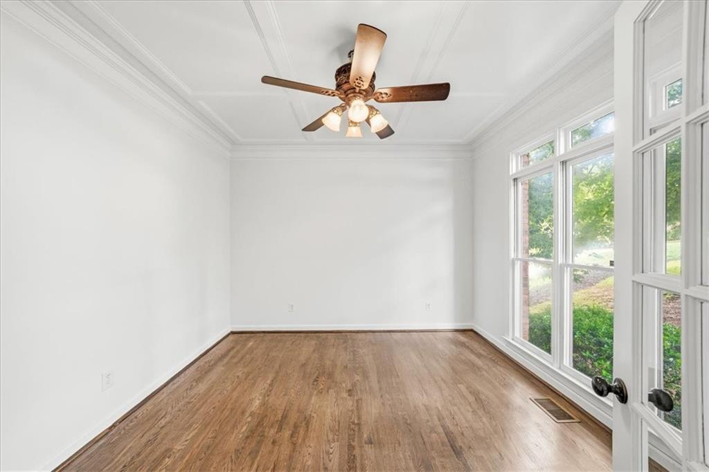 1710 Rising Mist Lane Cumming, GA 30041 - Photo 32 of 111 a view of empty room with wooden floor and fan