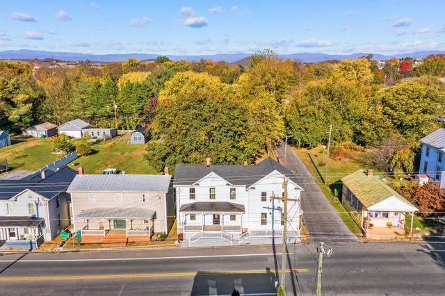 a view of a pathway along with wooden wall