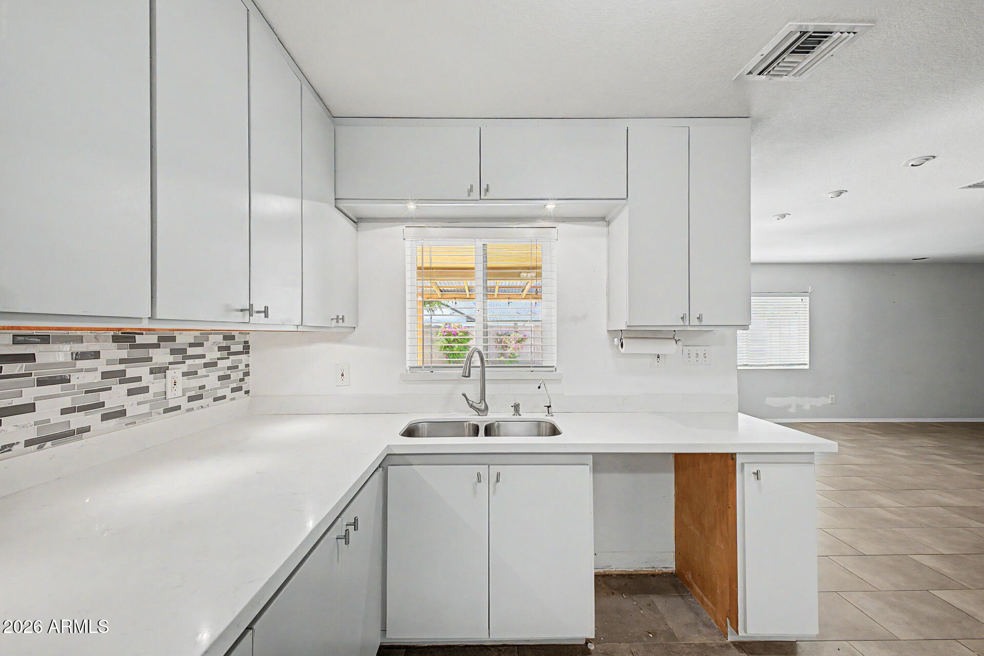 3907 East Mulberry Drive Phoenix, AZ 85018 - Photo 11 of 48 a kitchen with appliances cabinets and a sink