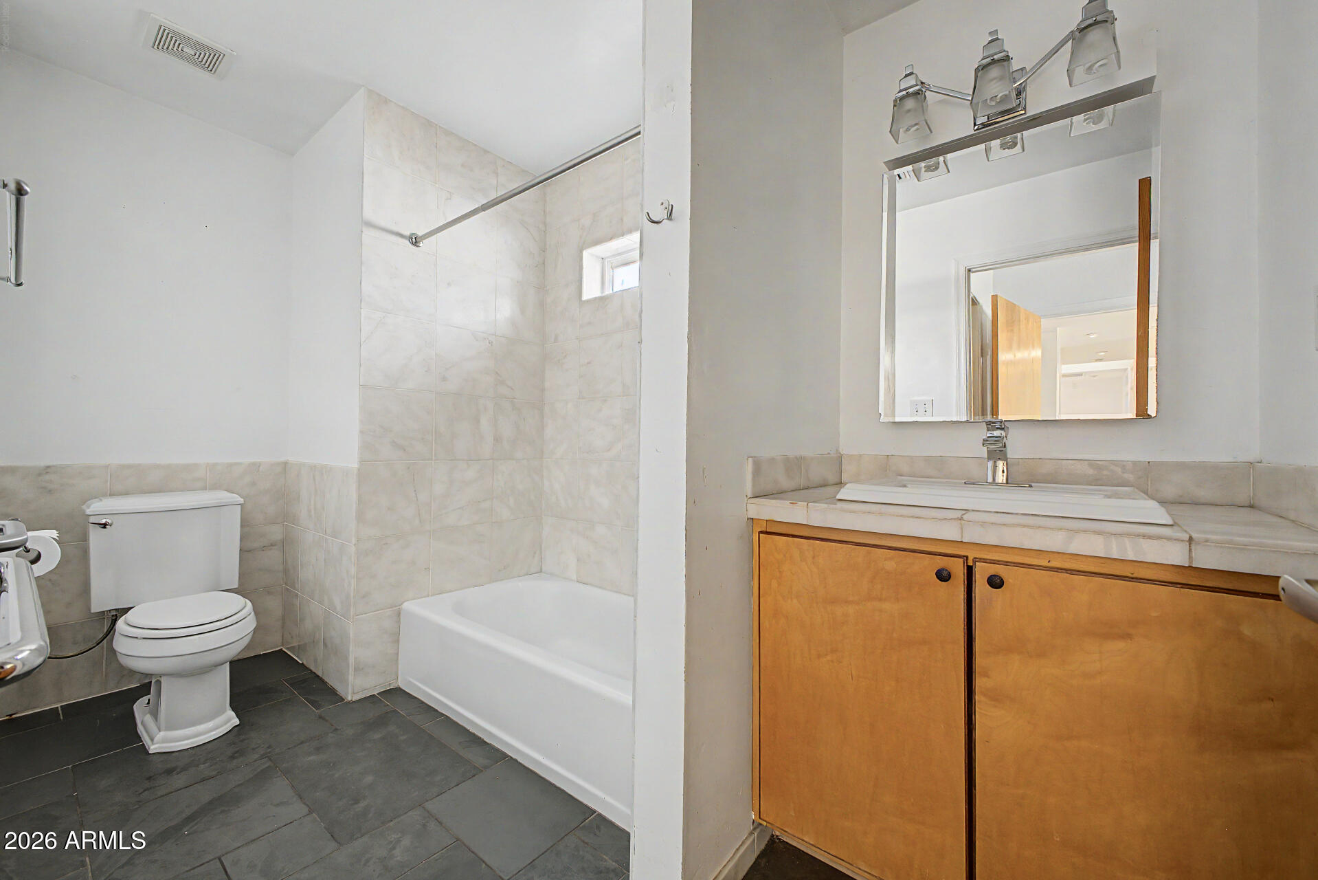 3907 East Mulberry Drive Phoenix, AZ 85018 - Photo 16 of 48 a bathroom with a sink a toilet and shower
