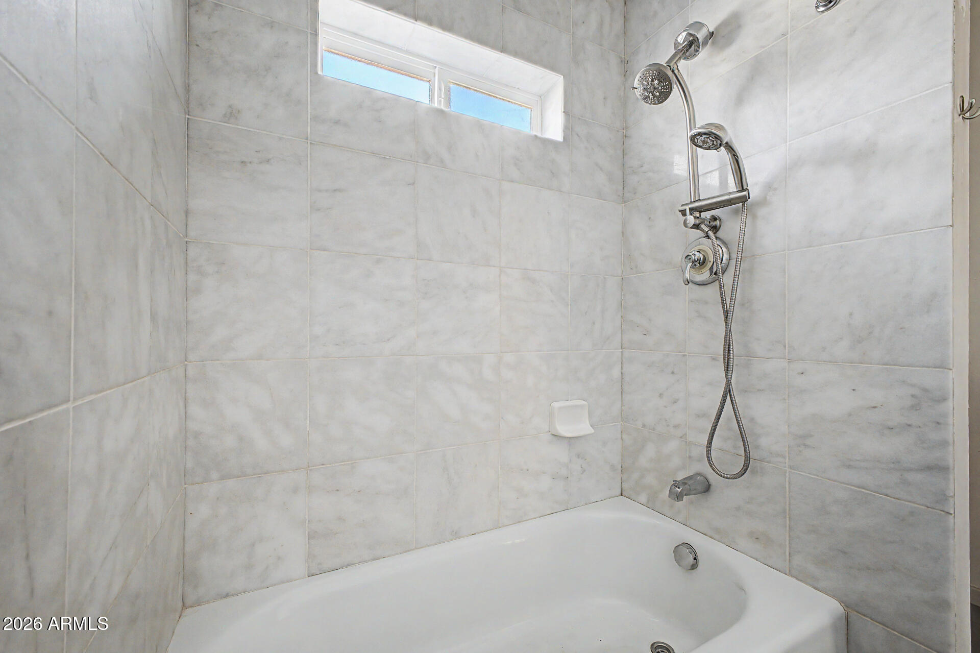 3907 East Mulberry Drive Phoenix, AZ 85018 - Photo 17 of 48 a bathroom with a bath tub with a shower