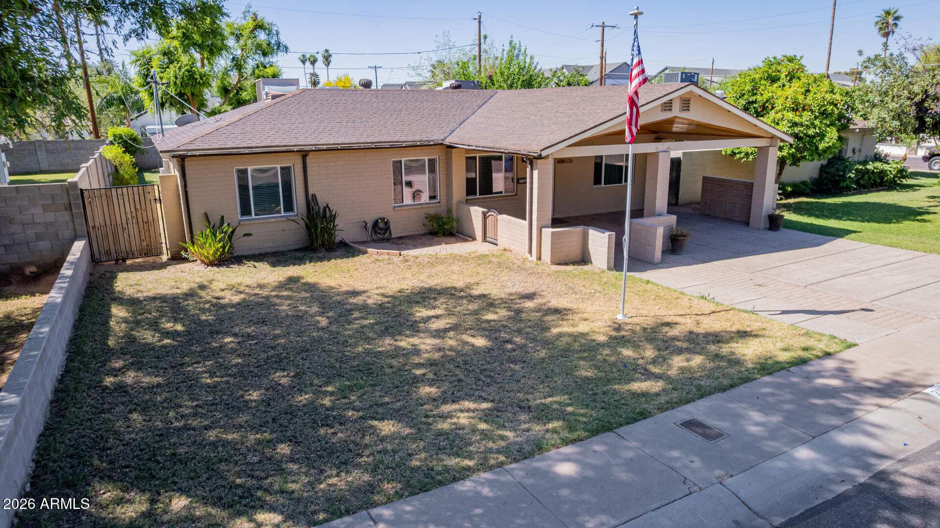 3907 East Mulberry Drive Phoenix, AZ 85018 - Photo 35 of 48 a front view of a house with a yard and garage