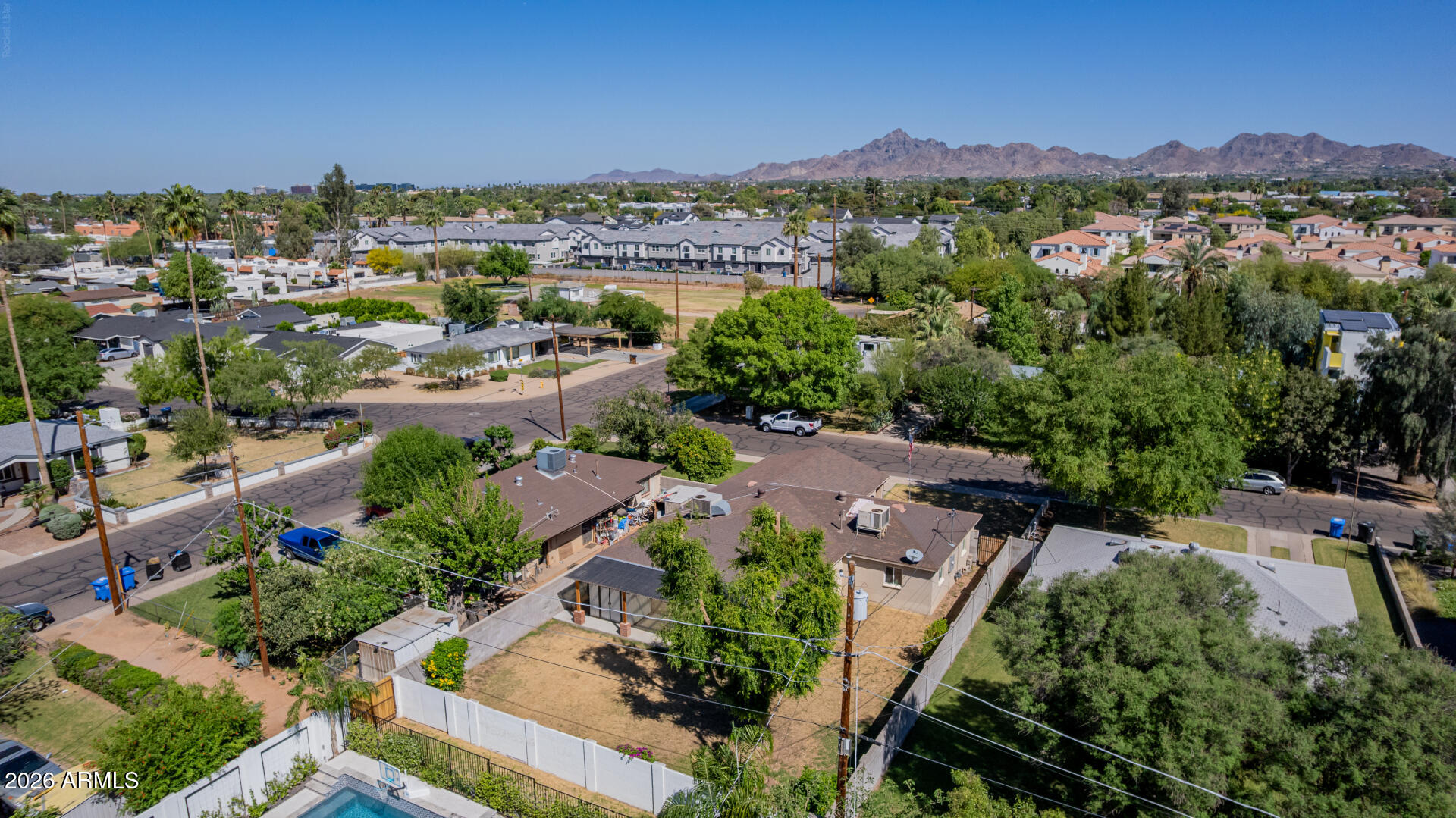 3907 East Mulberry Drive Phoenix, AZ 85018 - Photo 44 of 48 an aerial view of a city with lots of residential buildings ocean and mountain view in back