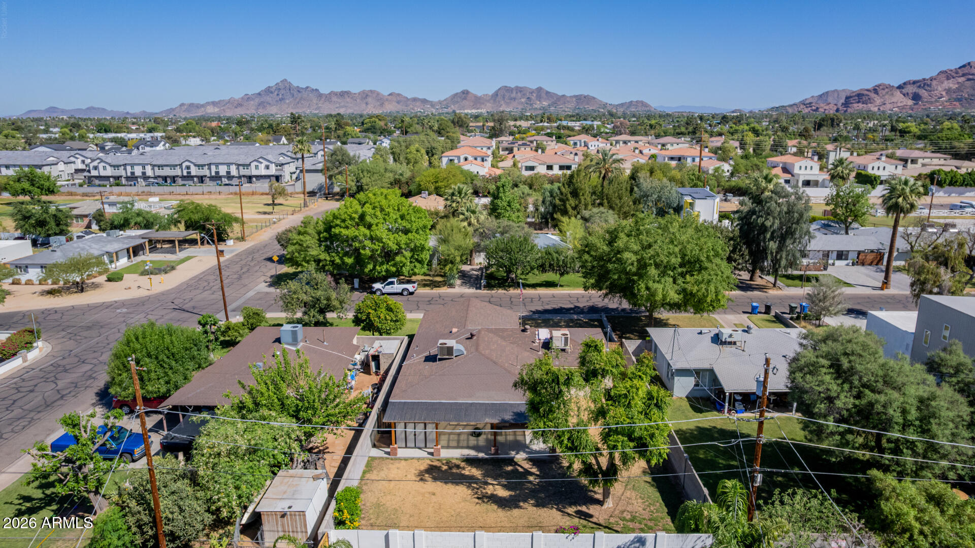 3907 East Mulberry Drive Phoenix, AZ 85018 - Photo 45 of 48 an aerial view of a city with lots of residential buildings ocean and mountain view in back