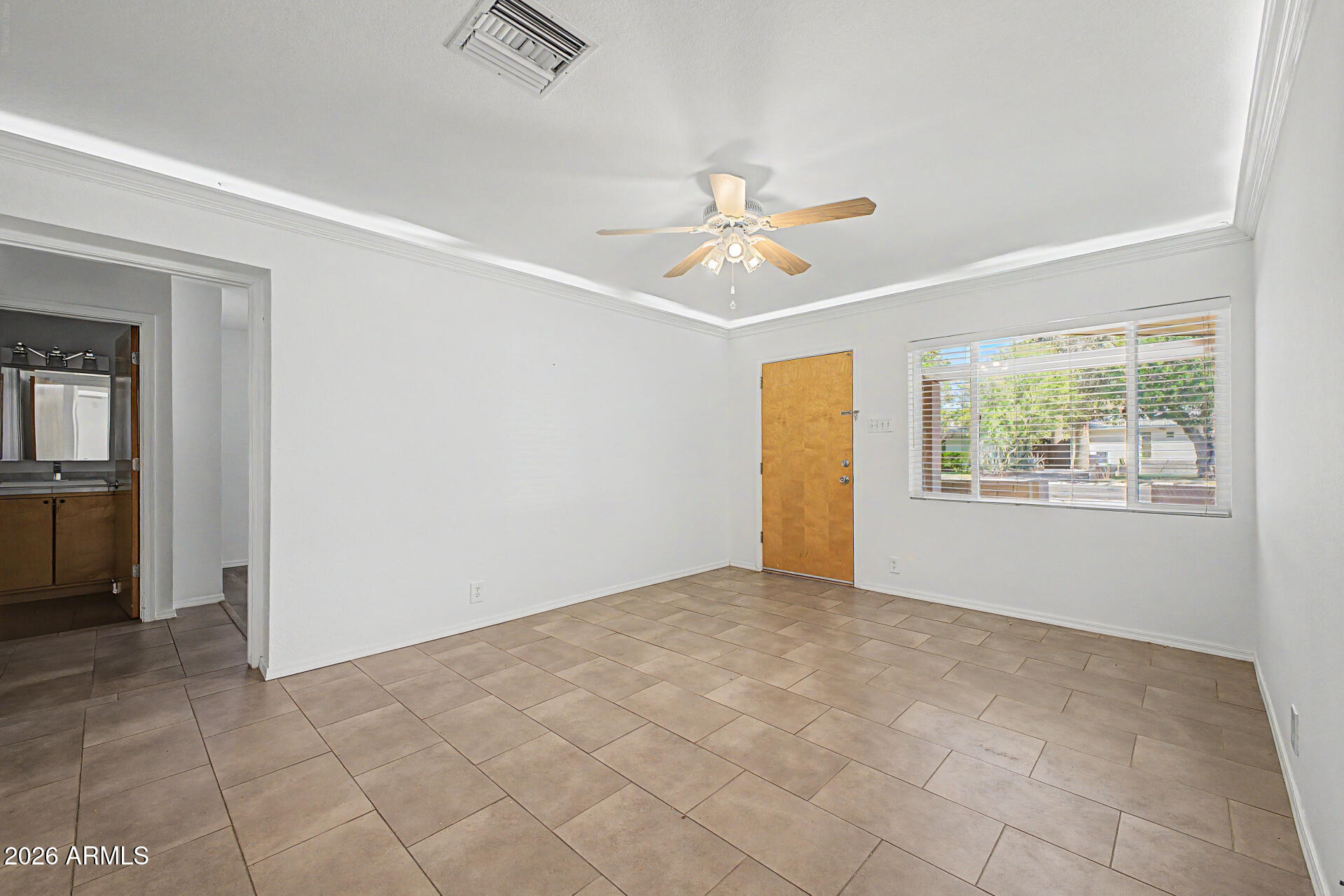 3907 East Mulberry Drive Phoenix, AZ 85018 - Photo 4 of 48 a view of an empty room with a window