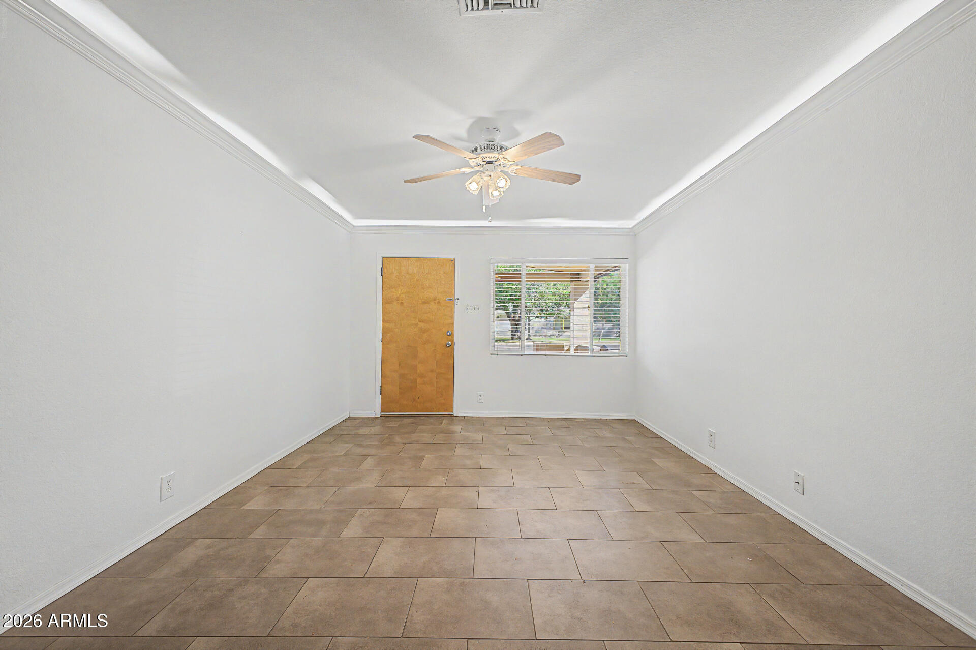 3907 East Mulberry Drive Phoenix, AZ 85018 - Photo 5 of 48 an empty room with windows and ceiling fan