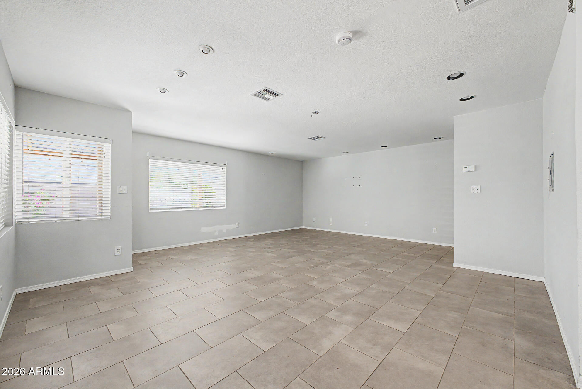 3907 East Mulberry Drive Phoenix, AZ 85018 - Photo 7 of 48 a view of an empty room with a window