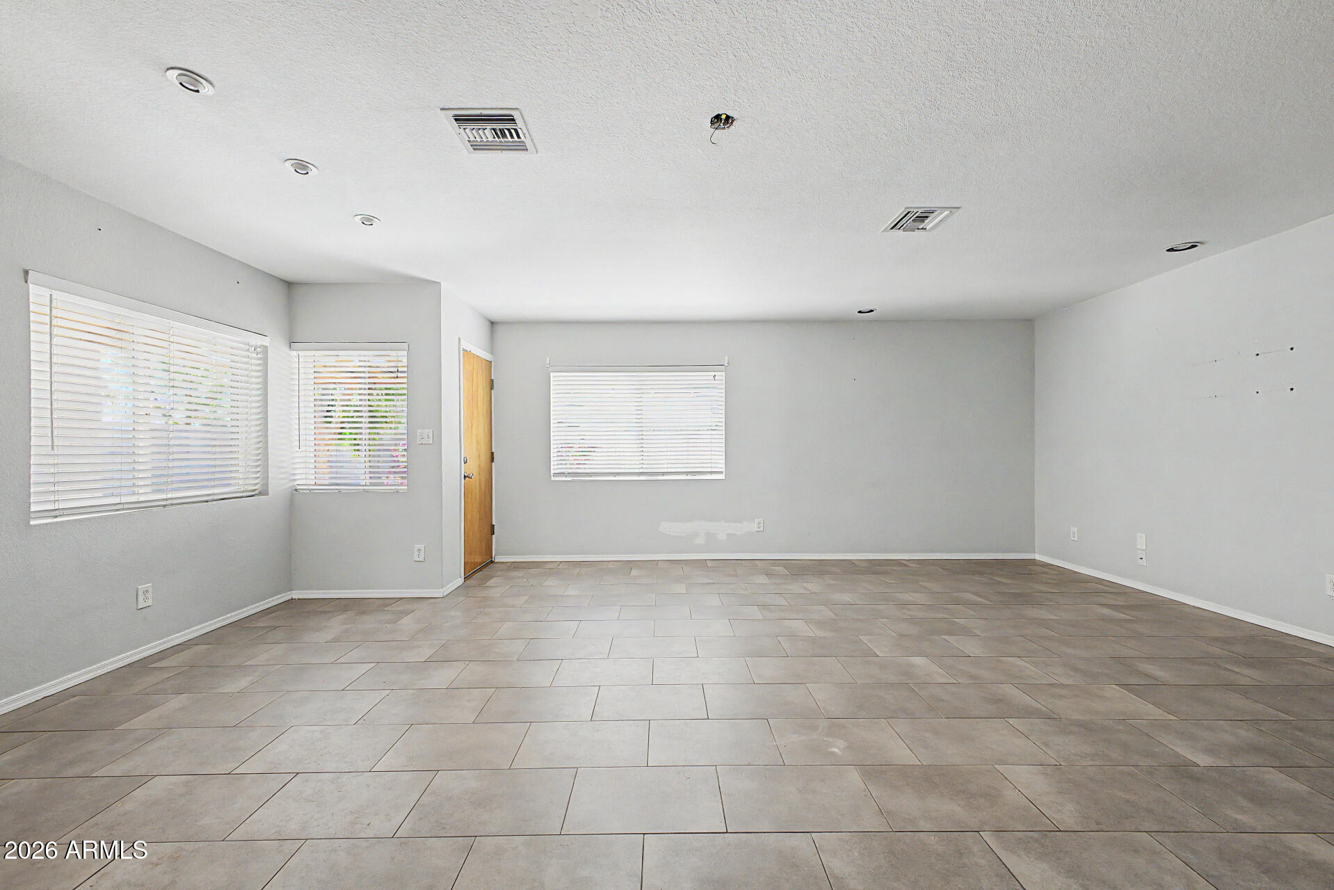3907 East Mulberry Drive Phoenix, AZ 85018 - Photo 8 of 48 a view of an empty room with a window