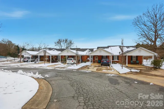 a living room with furniture window and wooden floor
