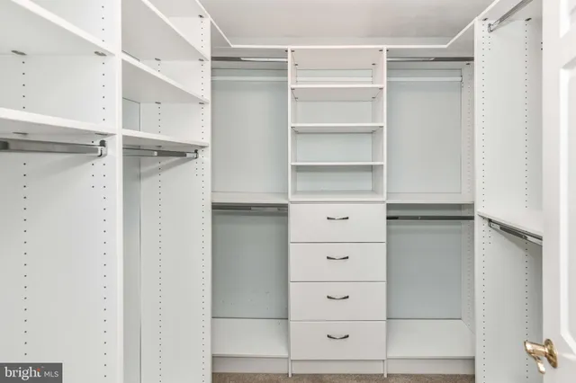 a view of an empty walk in closet