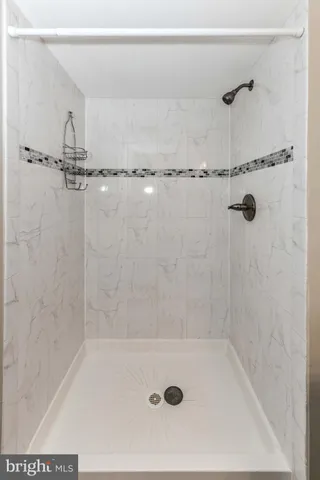 a bath tub sitting next to a shower