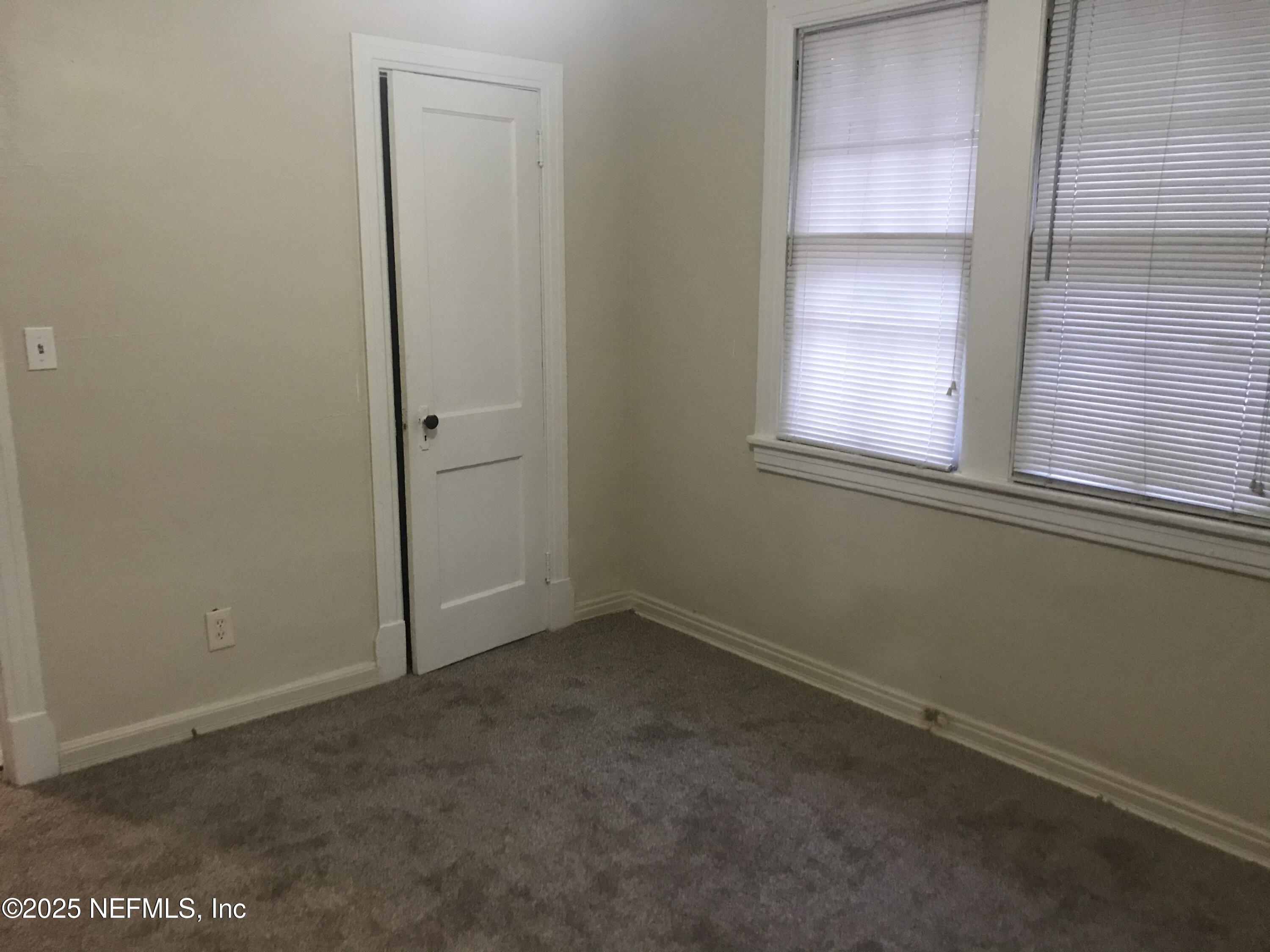 1322 Steele Street Jacksonville, FL 32209 - Photo 14 of 14 an empty room with windows