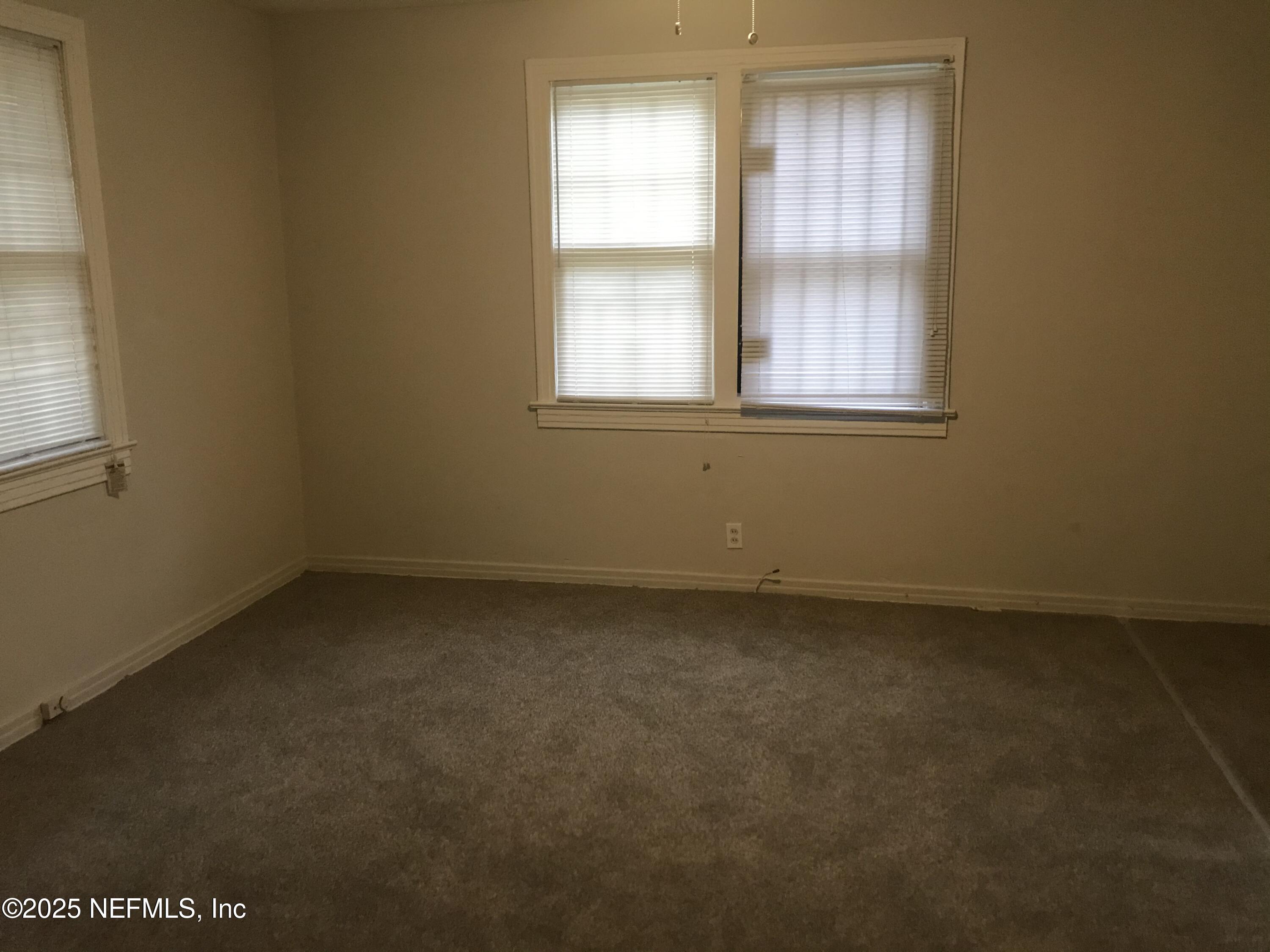1322 Steele Street Jacksonville, FL 32209 - Photo 9 of 14 an empty room with a window