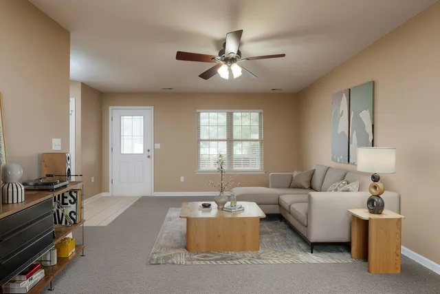 a living room with furniture and a window