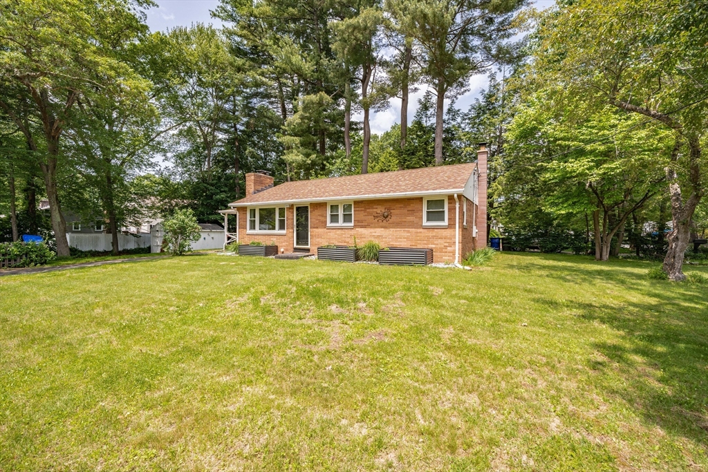 a view of a house with pool and garden