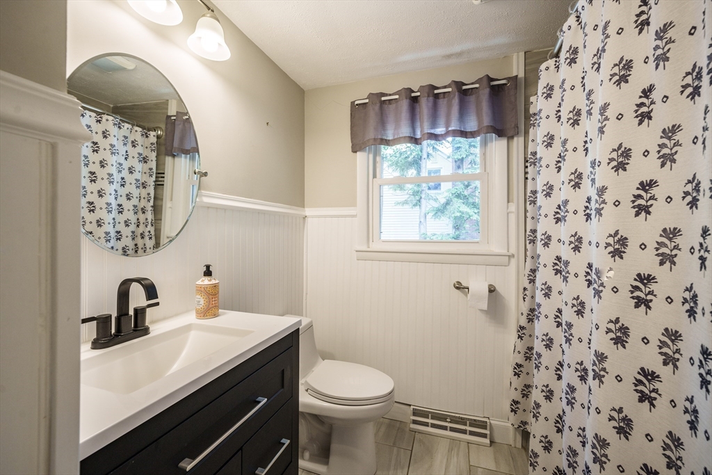 226 Dutchess Street Springfield, MA 01129 - Photo 17 of 39 a bathroom with a sink a toilet and a mirror
