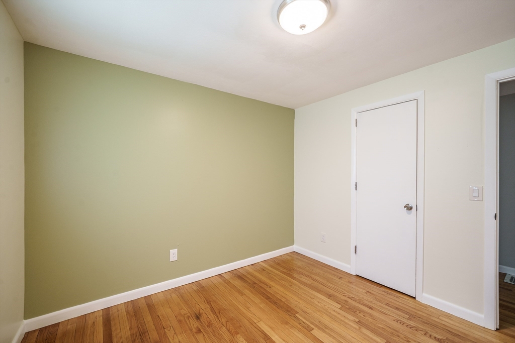 226 Dutchess Street Springfield, MA 01129 - Photo 19 of 39 a view of an empty room with wooden floor