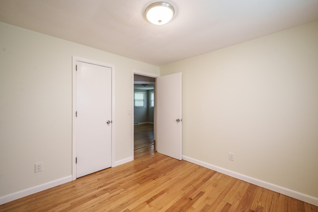 226 Dutchess Street Springfield, MA 01129 - Photo 20 of 39 a view of an empty room and wooden floor