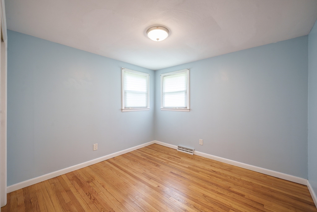 226 Dutchess Street Springfield, MA 01129 - Photo 21 of 39 an empty room with wooden floor and windows
