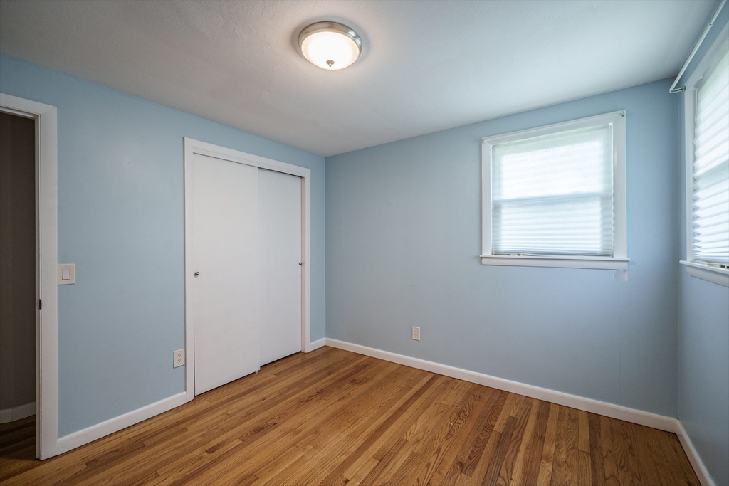 226 Dutchess Street Springfield, MA 01129 - Photo 22 of 39 an empty room with wooden floor and windows