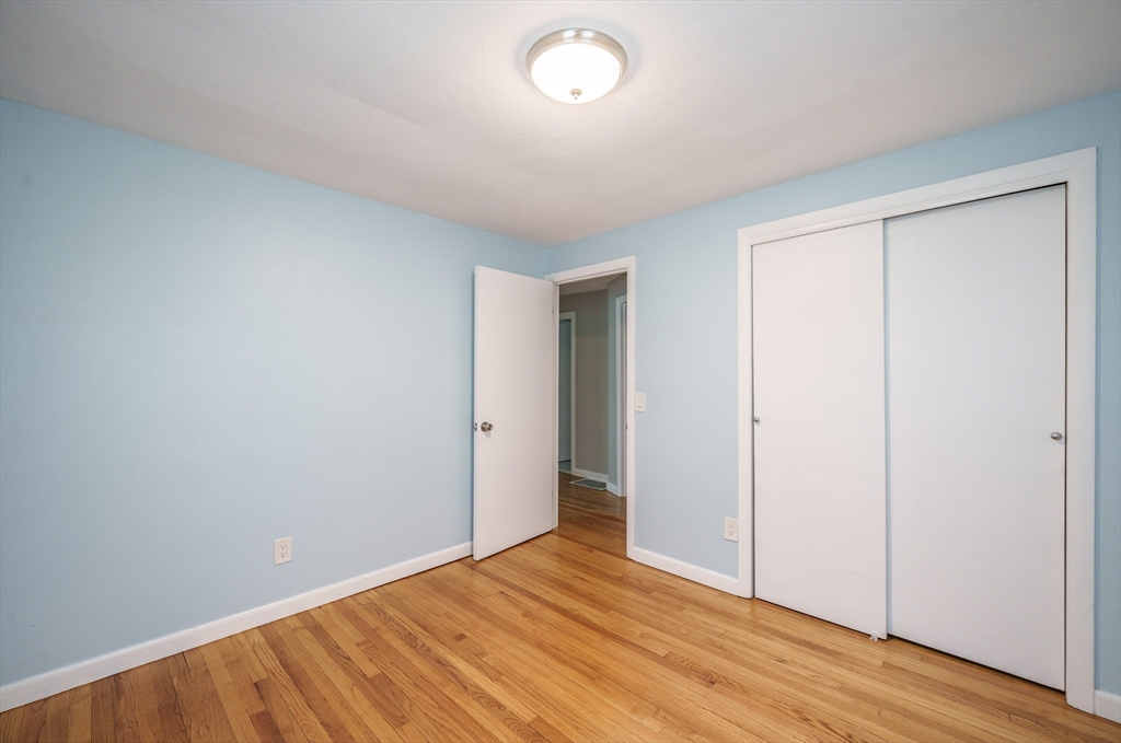 226 Dutchess Street Springfield, MA 01129 - Photo 23 of 39 a view of an empty room with wooden floor