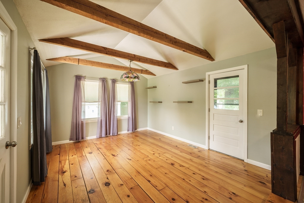 226 Dutchess Street Springfield, MA 01129 - Photo 5 of 39 a view of a room with wooden floor and a bathroom
