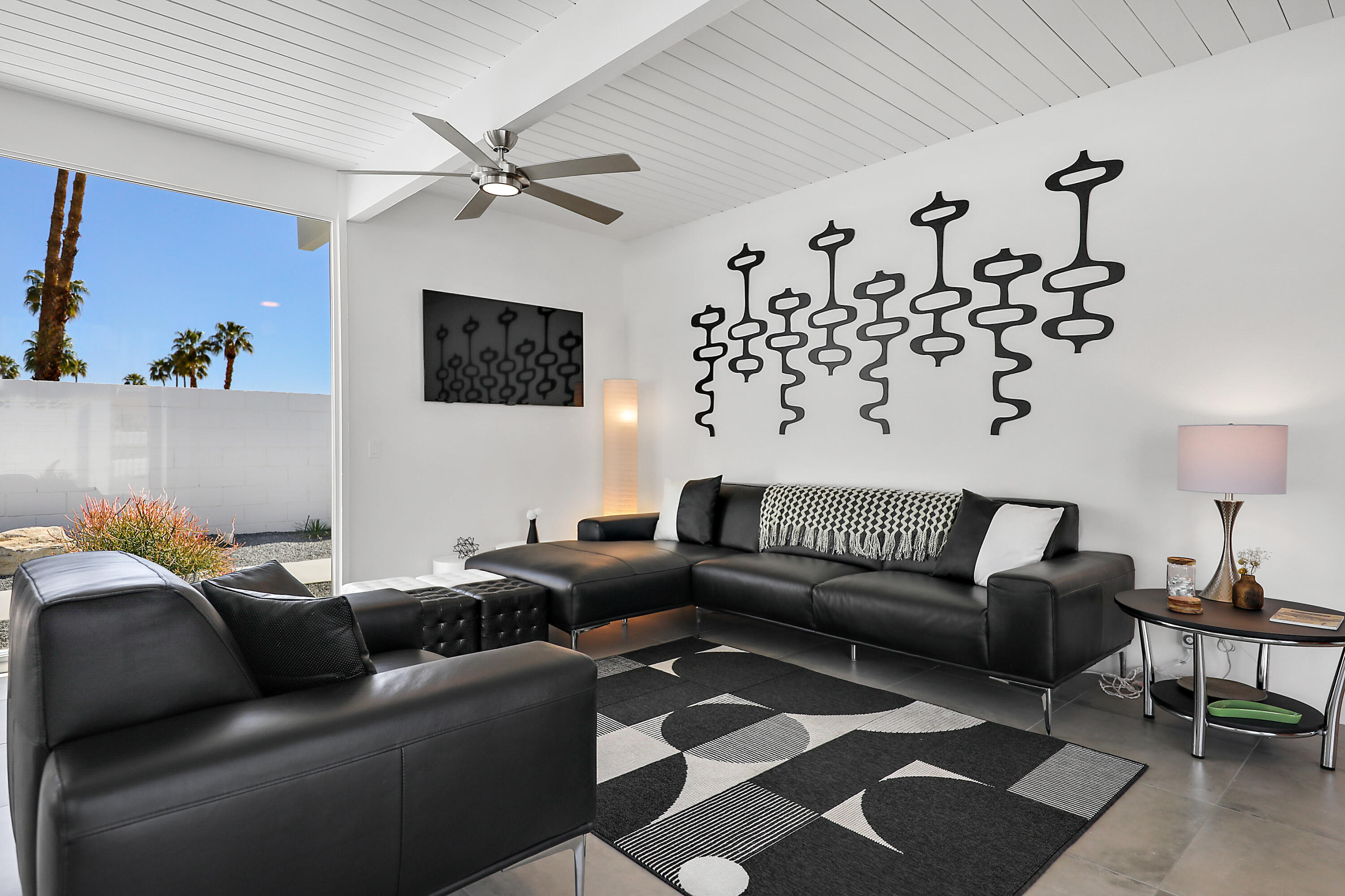 71350 Halgar Road Rancho Mirage, CA 92270 - Photo 12 of 33 a living room with furniture and a rug