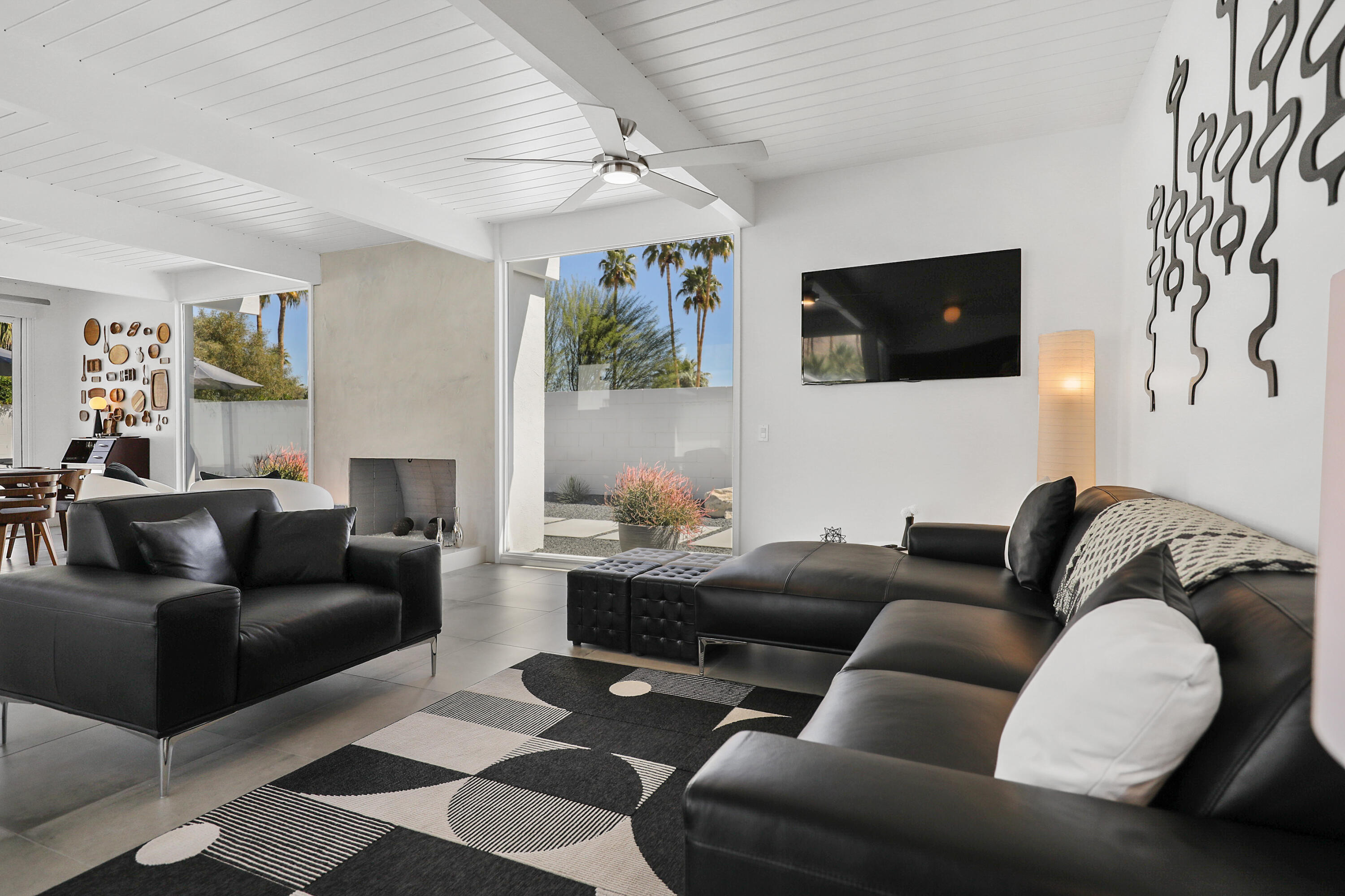 71350 Halgar Road Rancho Mirage, CA 92270 - Photo 13 of 33 a living room with furniture and a flat screen tv