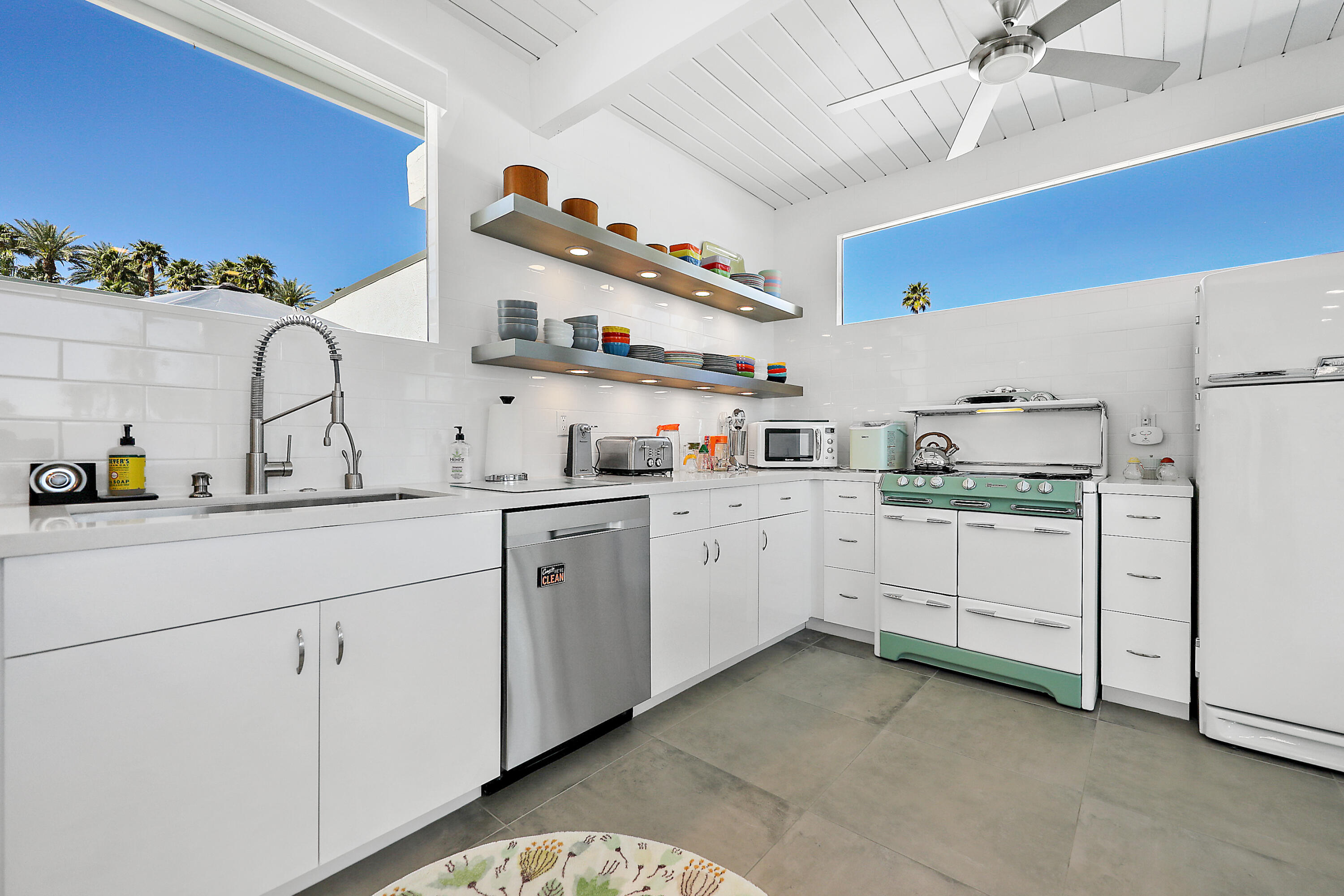 71350 Halgar Road Rancho Mirage, CA 92270 - Photo 2 of 33 a kitchen with cabinets stainless steel appliances and a sink