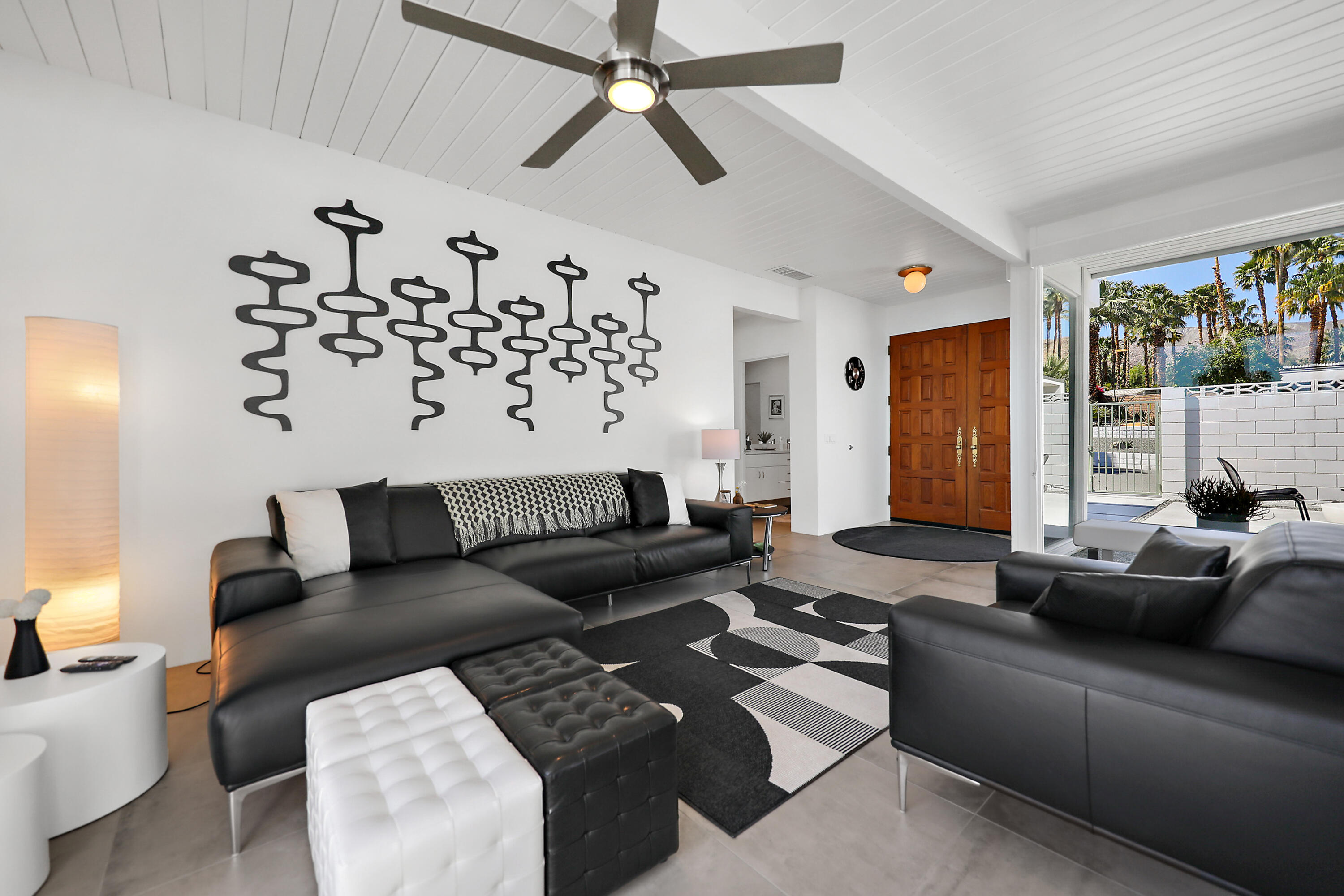 71350 Halgar Road Rancho Mirage, CA 92270 - Photo 3 of 33 a living room with furniture ceiling fan and a window