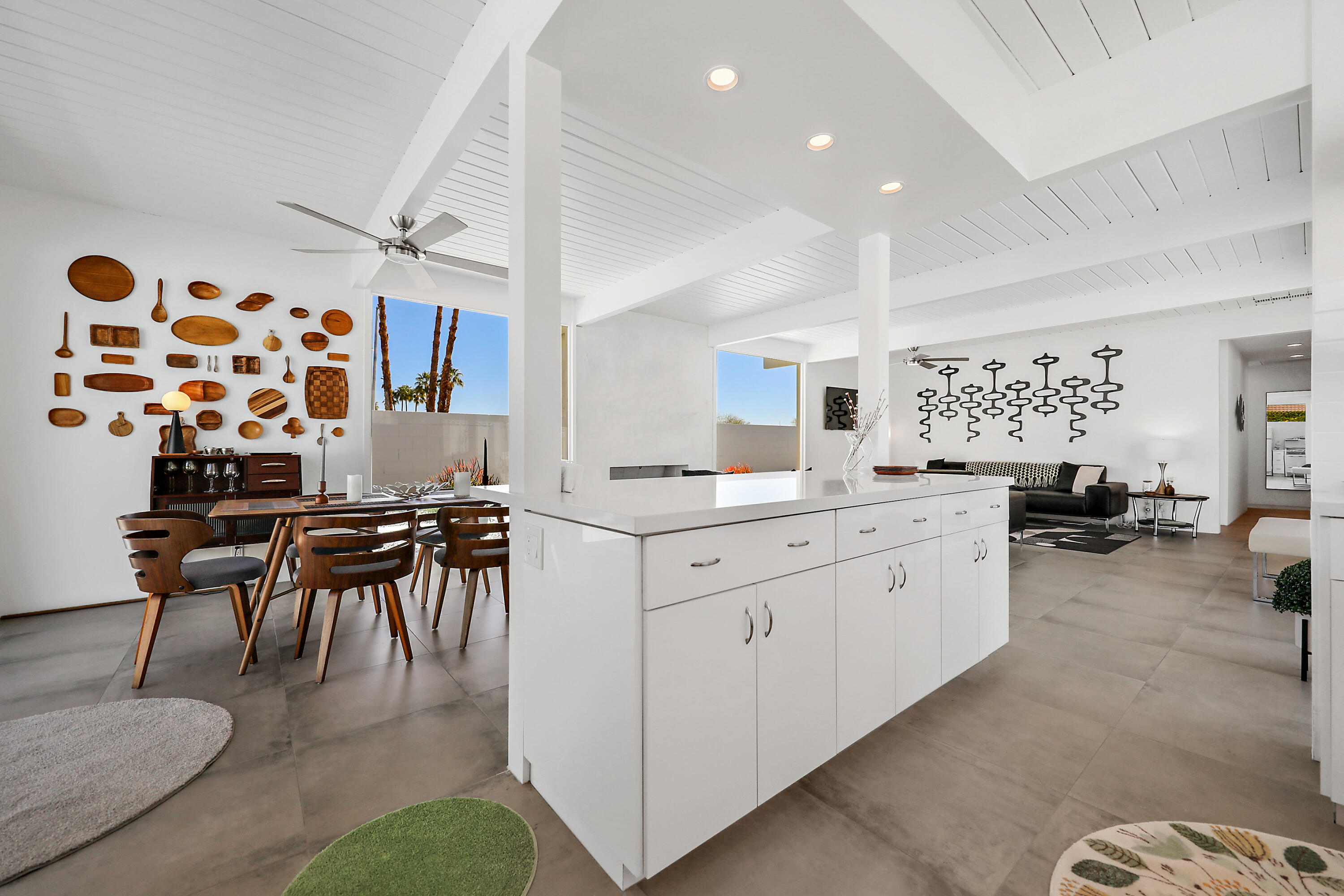 71350 Halgar Road Rancho Mirage, CA 92270 - Photo 4 of 33 a large white kitchen with a sink and a large window