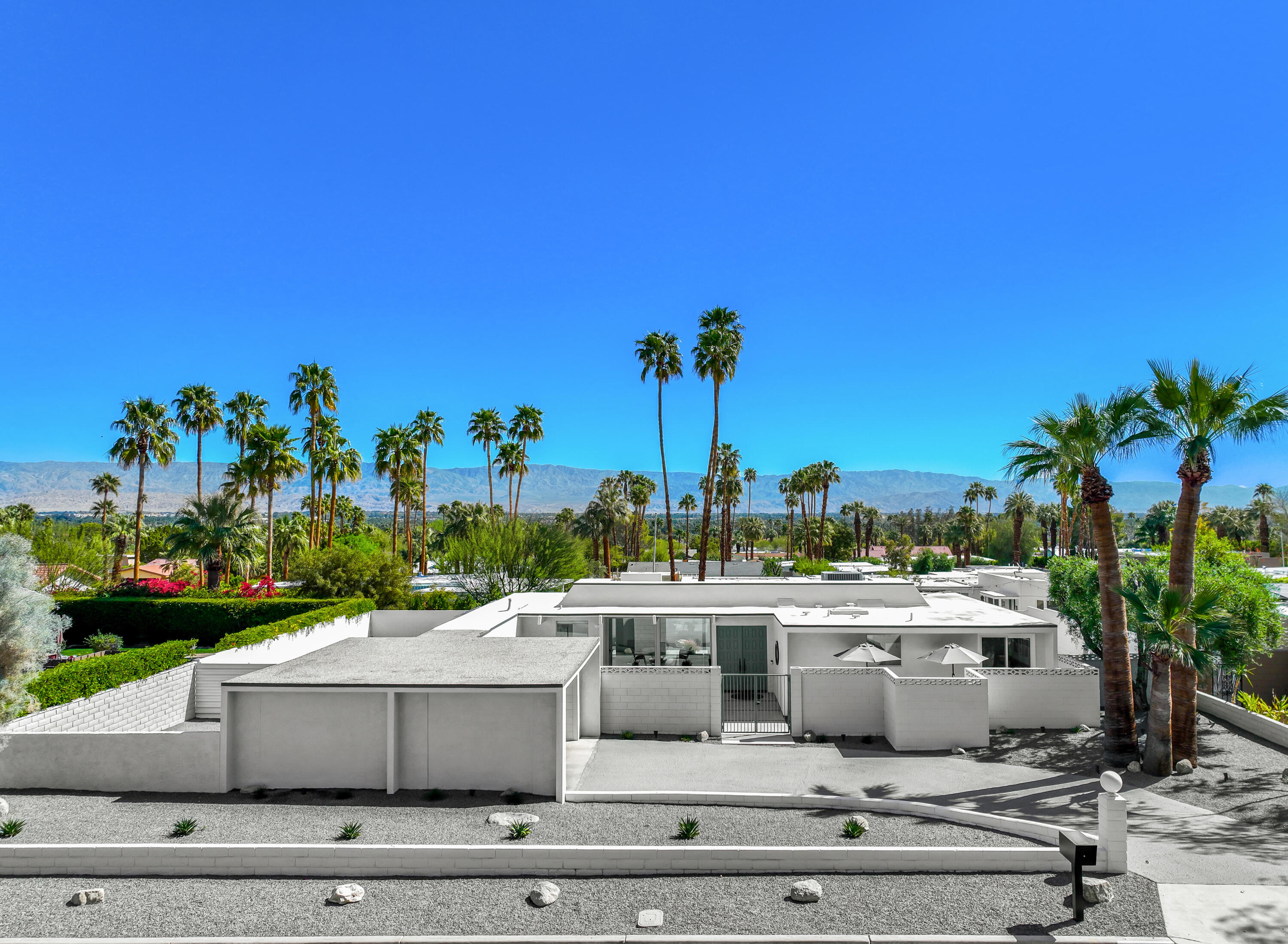 71350 Halgar Road Rancho Mirage, CA 92270 - Photo 7 of 33 a view of a terrace with potted plants