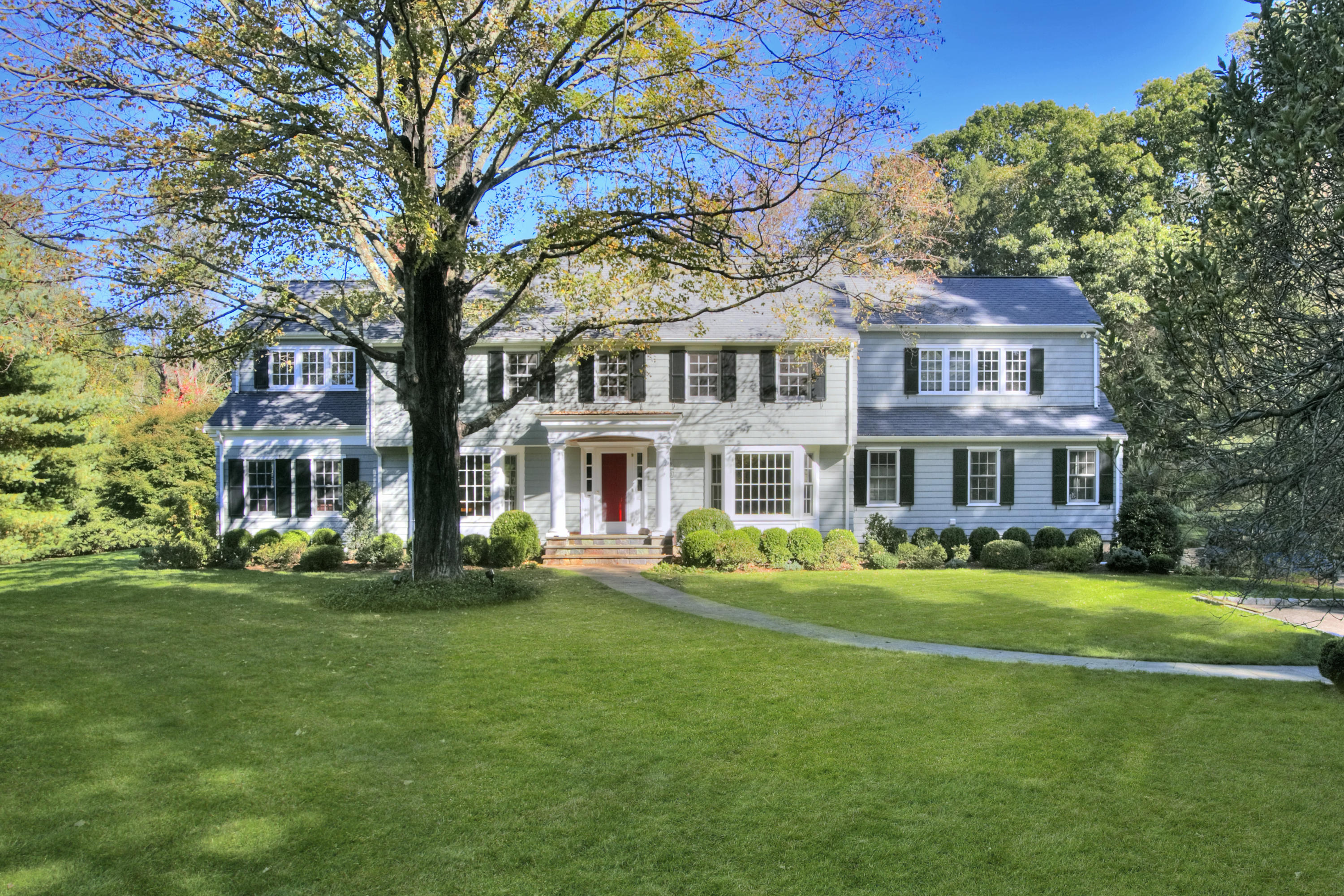 736 Silvermine Road New Canaan, CT 06840 - Photo 1 of 30 a front view of a building with a garden