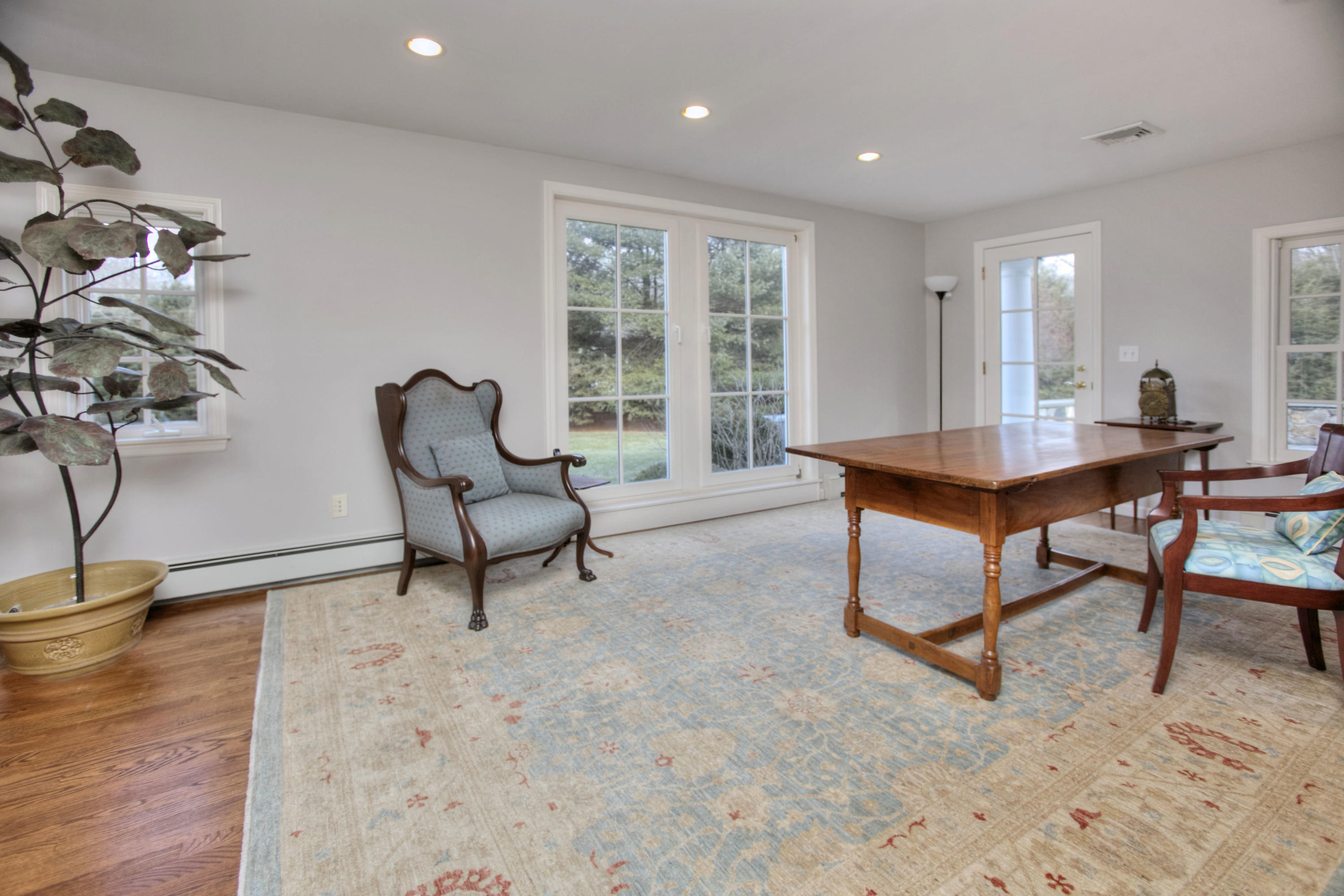 736 Silvermine Road New Canaan, CT 06840 - Photo 12 of 30 a living room with furniture and a potted plant