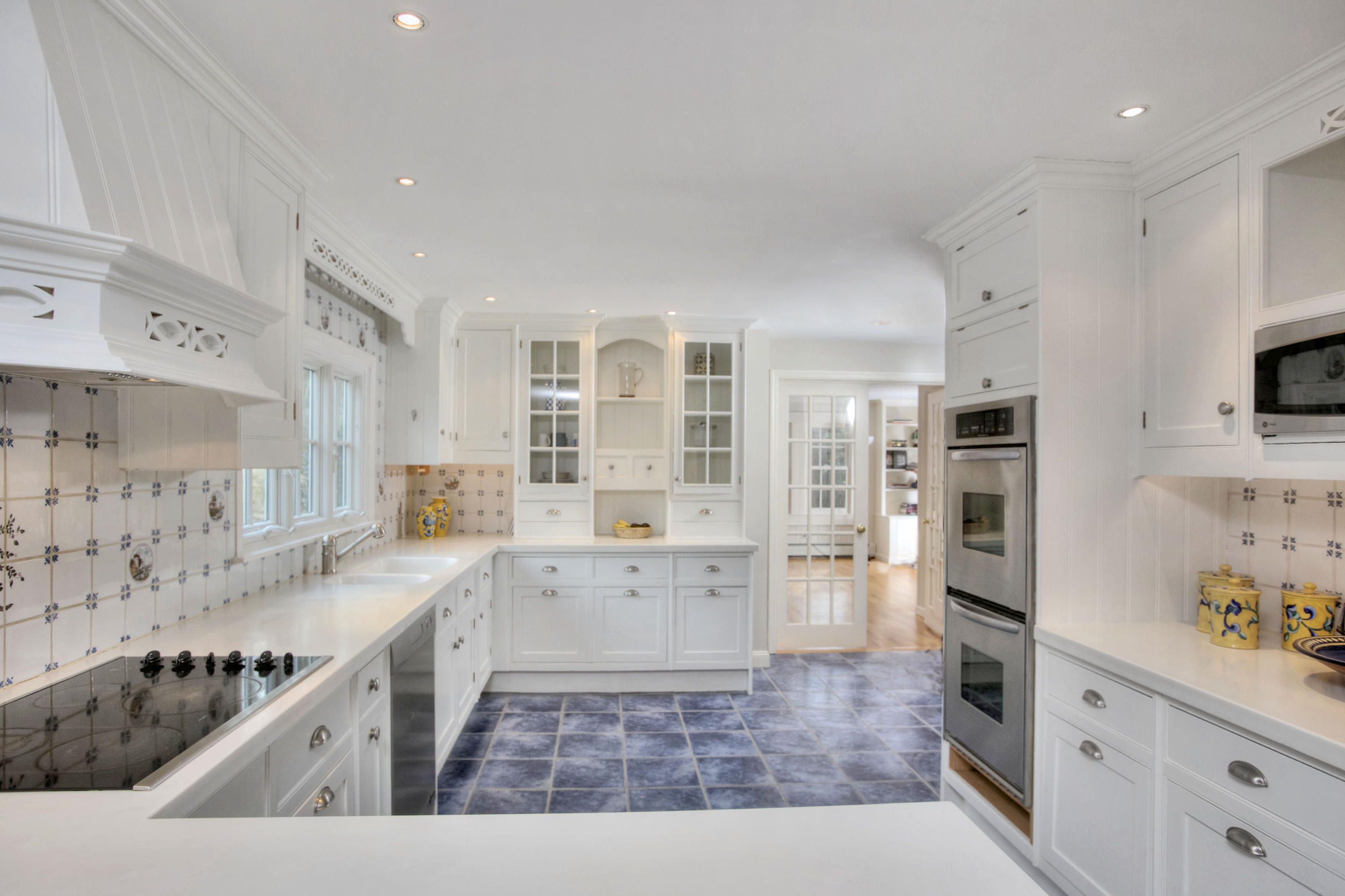 736 Silvermine Road New Canaan, CT 06840 - Photo 3 of 30 a kitchen with stainless steel appliances granite countertop a sink stove and cabinets