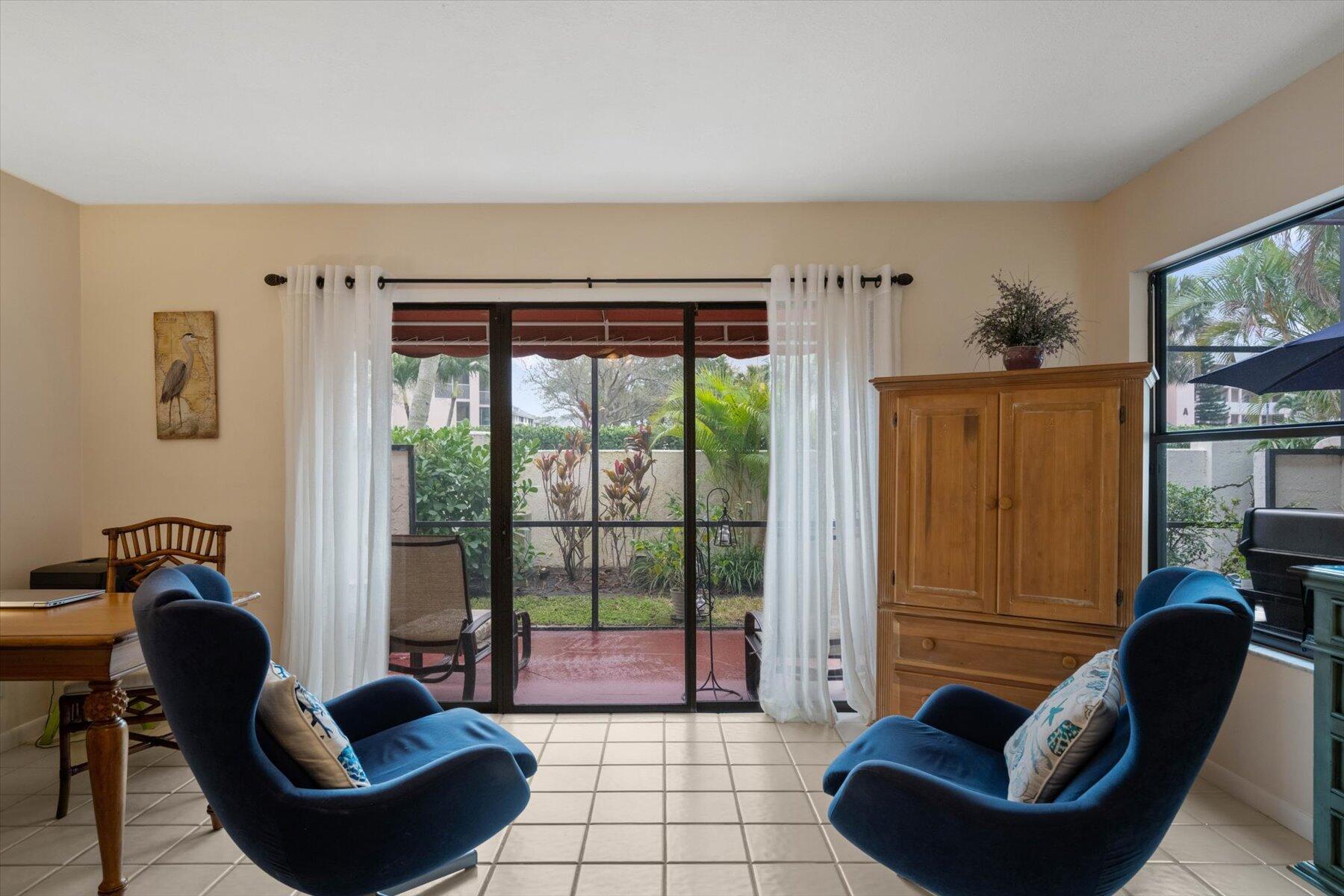 130 Palm Avenue, Unit 20 Jupiter, FL 33477 - Photo 12 of 51 a living room with furniture and a window